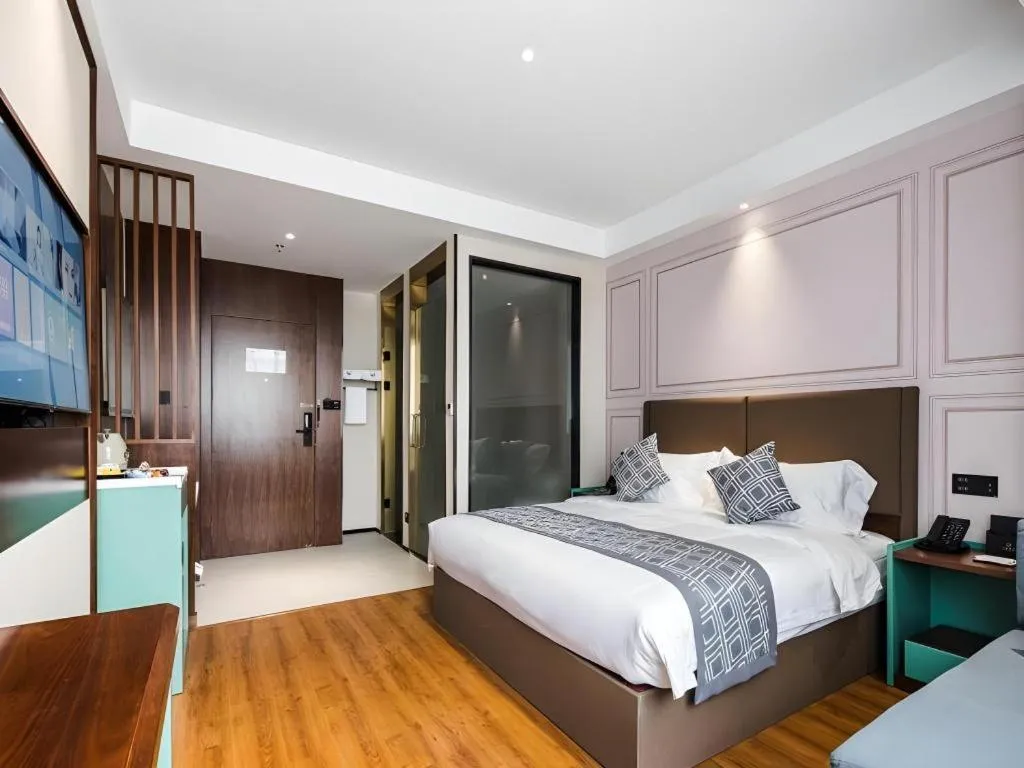 Bed in GEM Hotel Changzhou Xuejia'aoyuan North High-Speed Railway Station