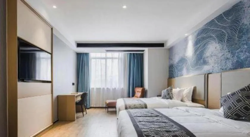 Bed in GEM Hotel Changzhou Xuejia'aoyuan North High-Speed Railway Station