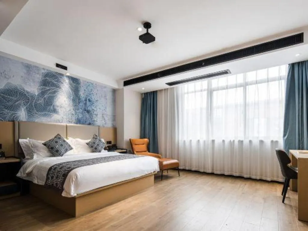 Bed in GEM Hotel Changzhou Xuejia'aoyuan North High-Speed Railway Station