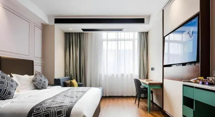 Bed in GEM Hotel Changzhou Xuejia'aoyuan North High-Speed Railway Station Bed in GEM Hotel Changzhou Xuejia'aoyuan North High-Speed Railway Station