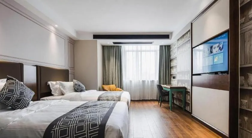 Bed in GEM Hotel Changzhou Xuejia'aoyuan North High-Speed Railway Station