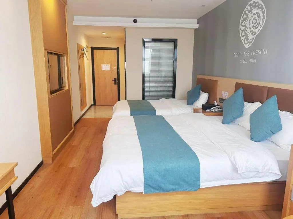 Bed in Shell Hotel Bozhou Lixin County Passenger Center
