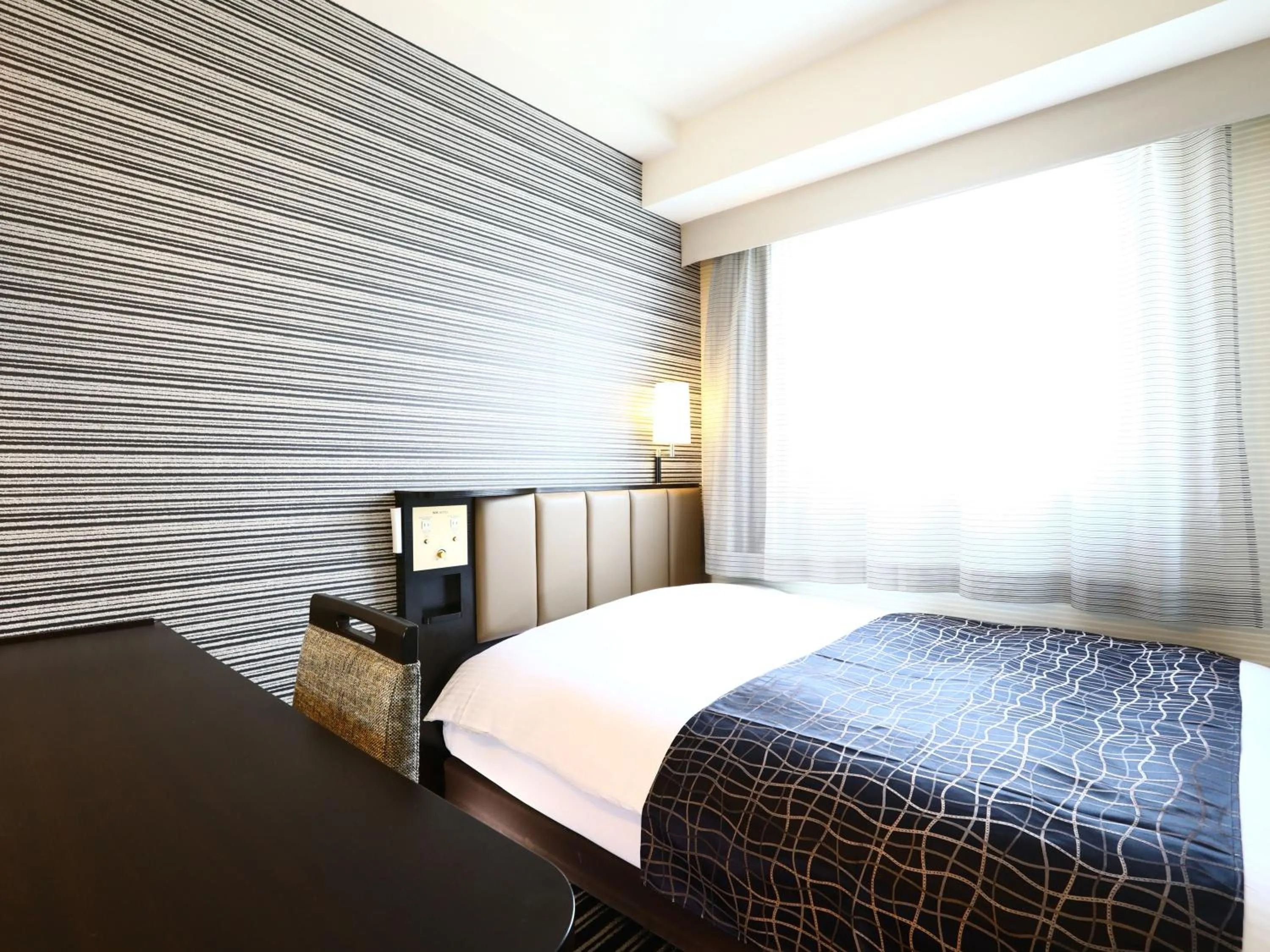 Photo of the whole room, Bed in APA Hotel Higashi Shinjuku Kabukicho