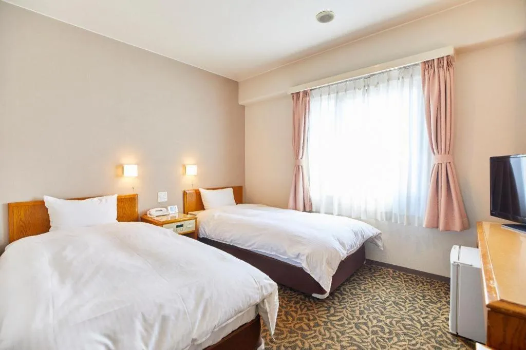 Bed in Inuyama Central Hotel