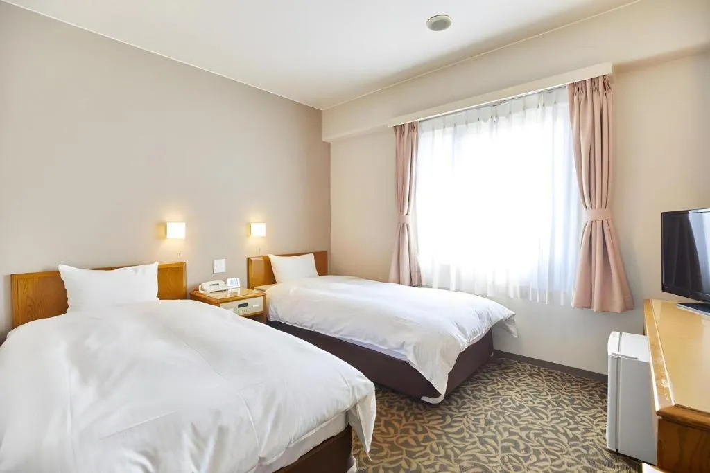 Bed in Inuyama Central Hotel