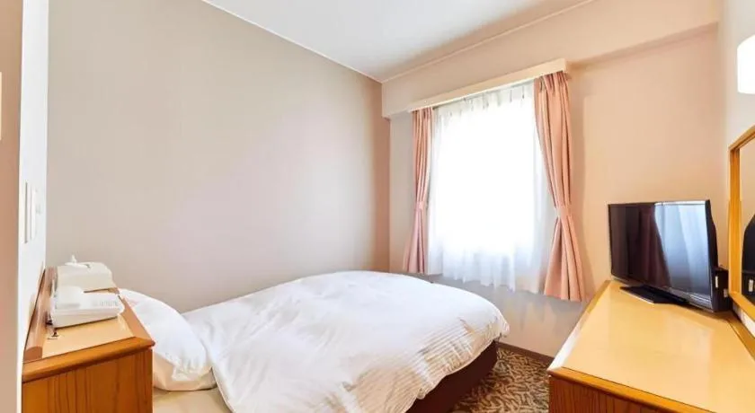 Bed in Inuyama Central Hotel