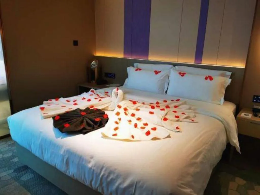 Bed in Lavande Hotel Shanghai Jing'an Shibei Gaoxin