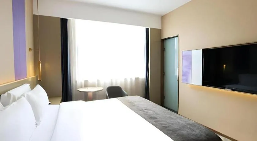 Bed in Lavande Hotel Zhongshan Shiqi Daxinxinduhui North Zhongshan Station