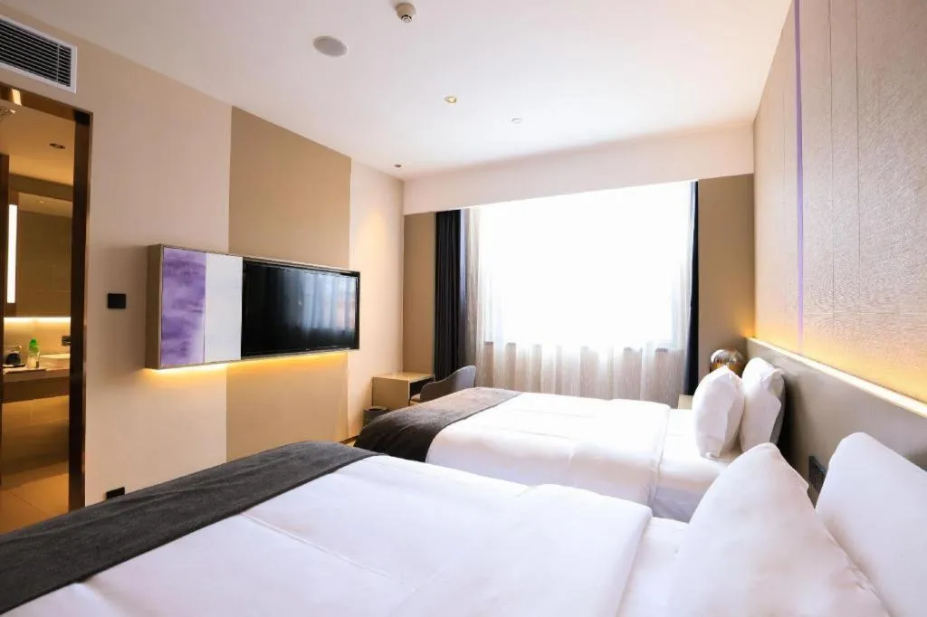 Bed in Lavande Hotel Zhongshan Shiqi Daxinxinduhui North Zhongshan Station