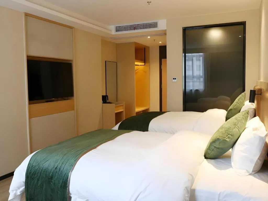 Bed in Green Tree Inn Express Chizhou Gymnasium