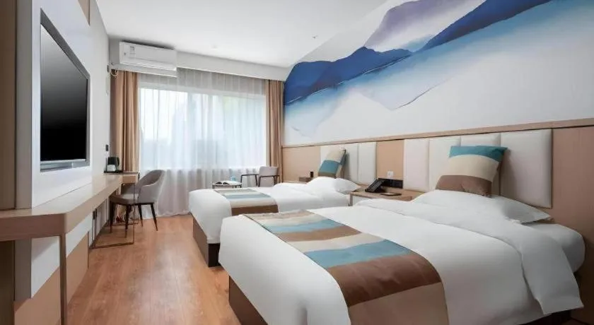 Bed in VX Hotel Beijing Daxing Wufutang Metro Station Zhongke Dianshanggu