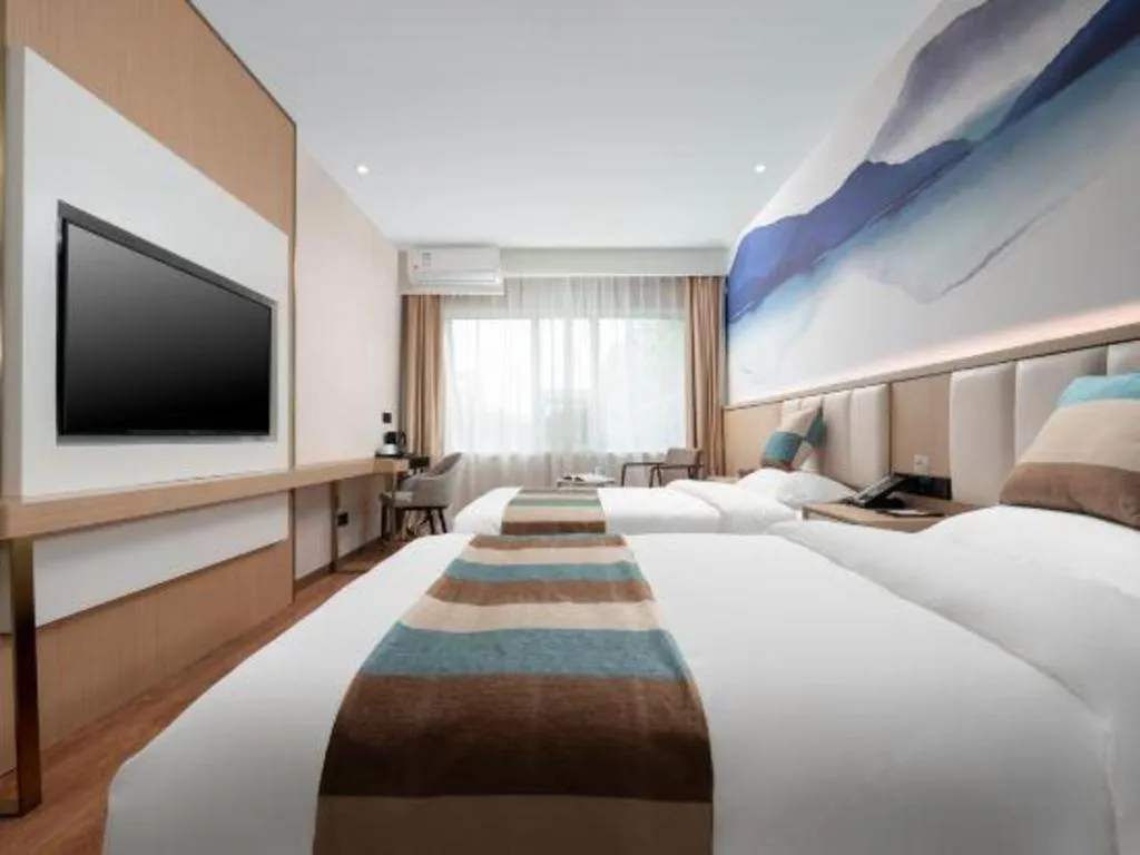 Bed in VX Hotel Beijing Daxing Wufutang Metro Station Zhongke Dianshanggu