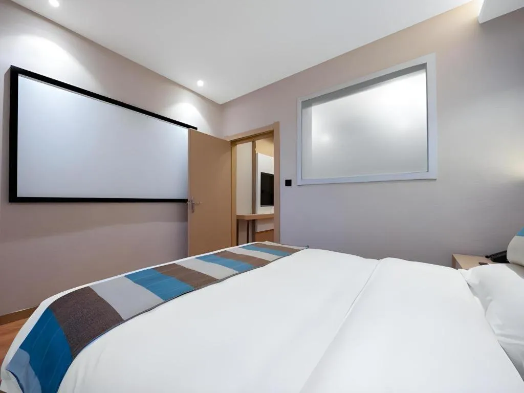 Bed in VX Hotel Beijing Daxing Wufutang Metro Station Zhongke Dianshanggu