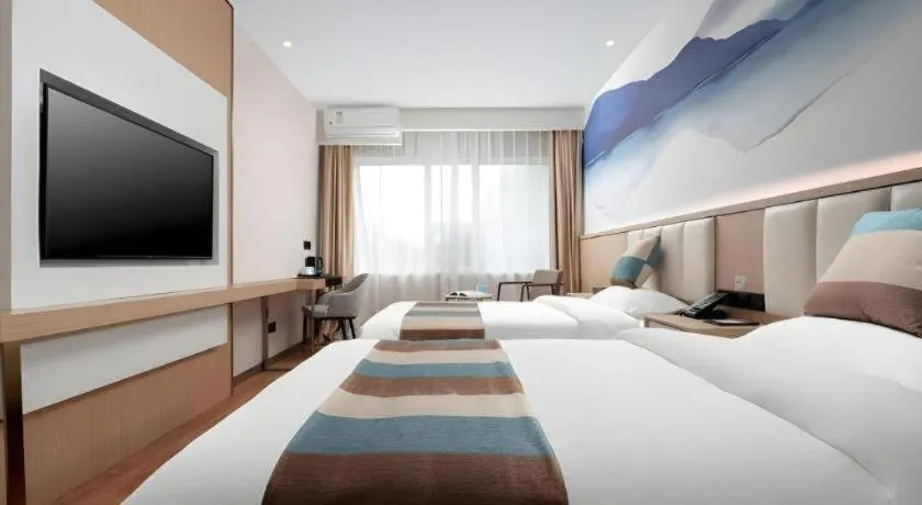 Bed in VX Hotel Beijing Daxing Wufutang Metro Station Zhongke Dianshanggu