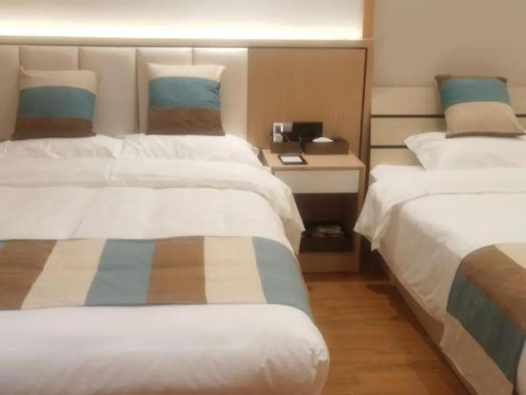 Bed in VX Hotel Beijing Daxing Wufutang Metro Station Zhongke Dianshanggu