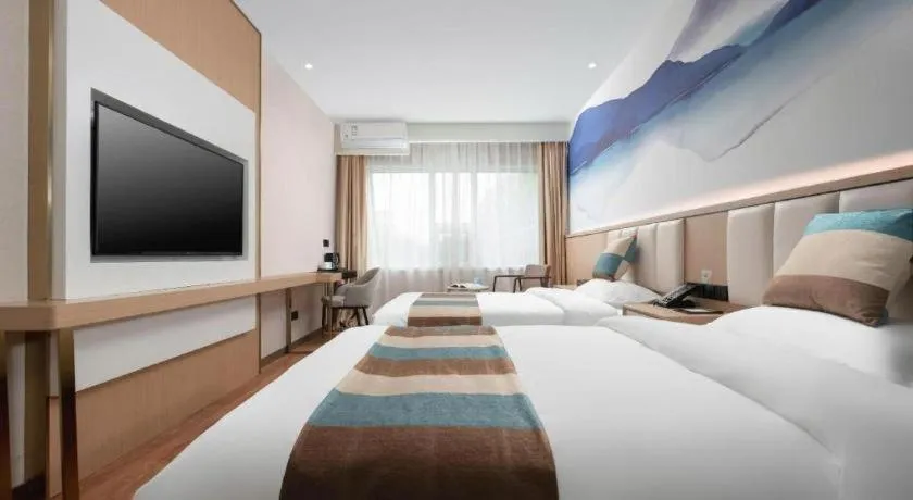 Bed in VX Hotel Beijing Daxing Wufutang Metro Station Zhongke Dianshanggu