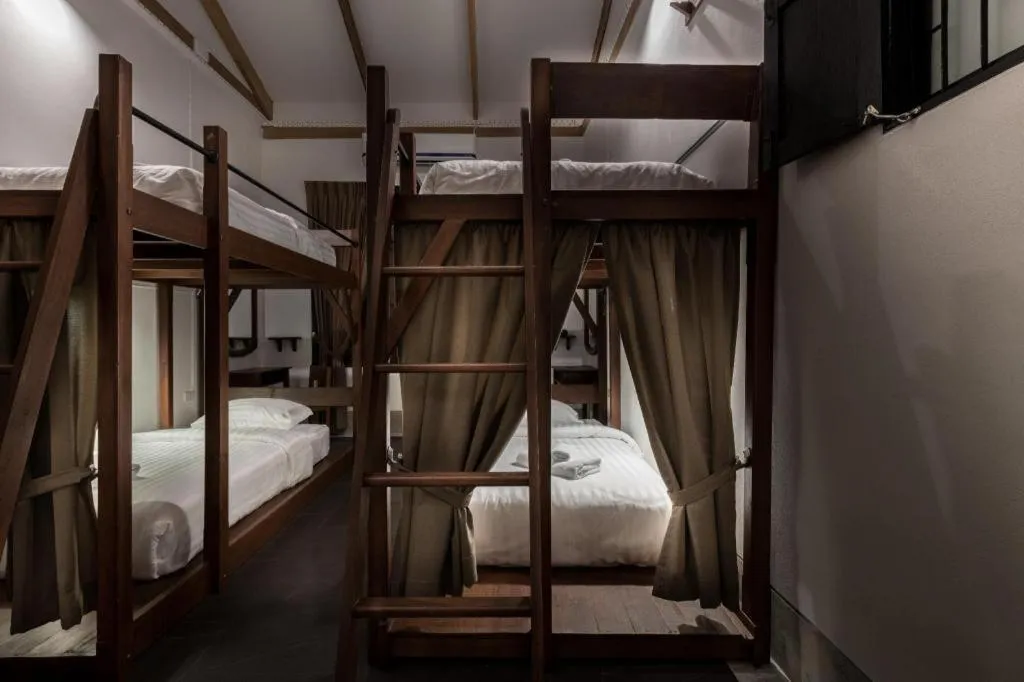 Bed in Uthai Heritage Hotel