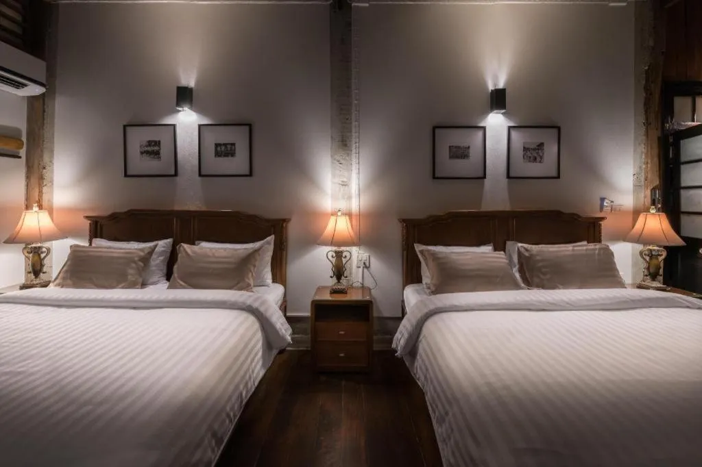 Bed in Uthai Heritage Hotel