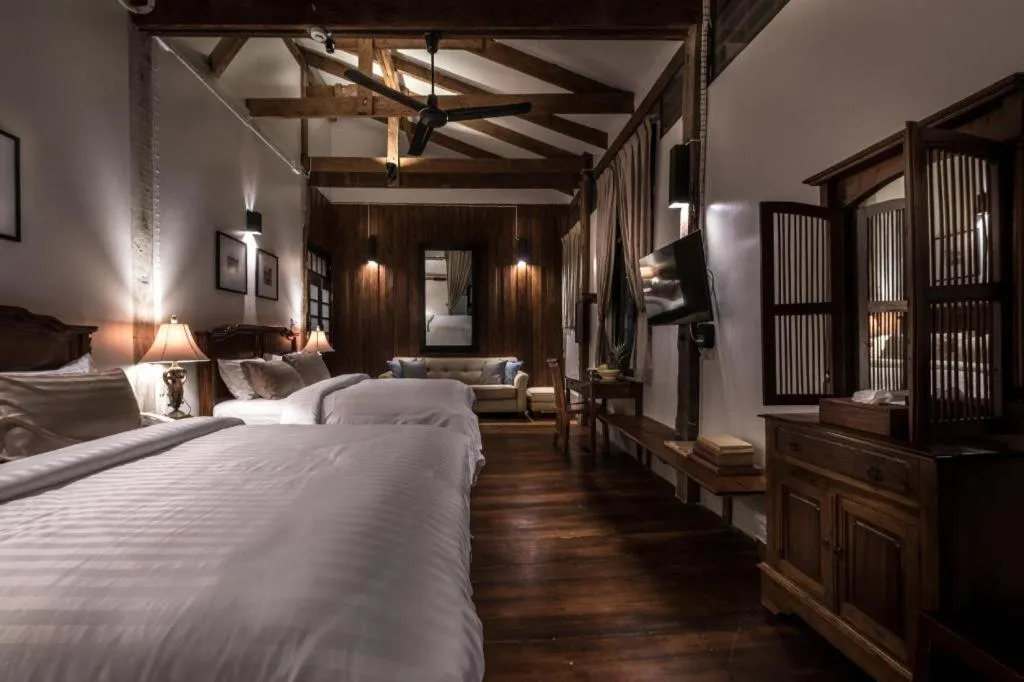 Bed in Uthai Heritage Hotel