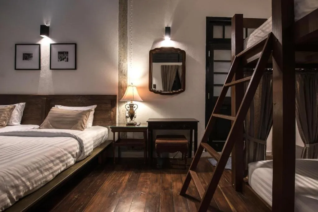 Bed in Uthai Heritage Hotel