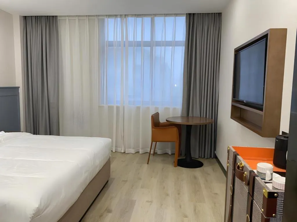 Bed in Premier City Comfort Hotel Yangzhou Shouxi Lake West Gate Weiyang Road Siji Garden