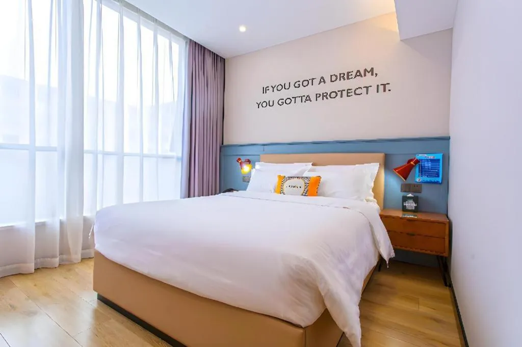 Bed in Premier City Comfort Hotel Yangzhou Shouxi Lake West Gate Weiyang Road Siji Garden