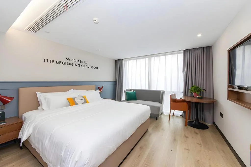 Bed in Premier City Comfort Hotel Yangzhou Shouxi Lake West Gate Weiyang Road Siji Garden