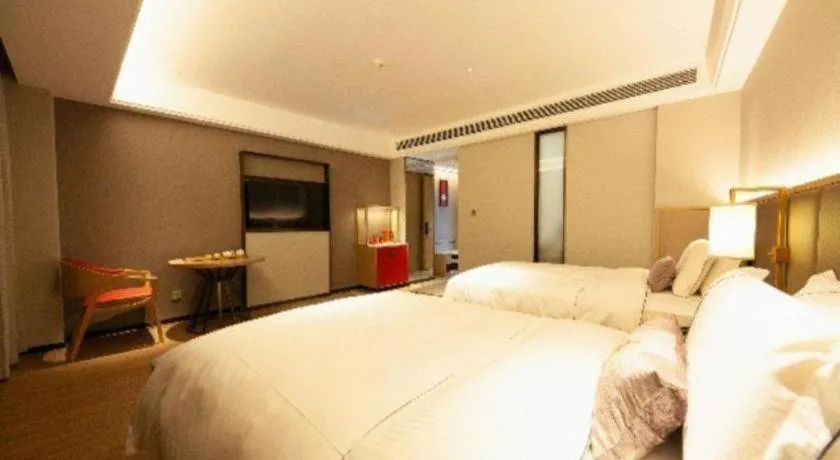 Bed in Echeng Hotel Hezhou Shizheng Square