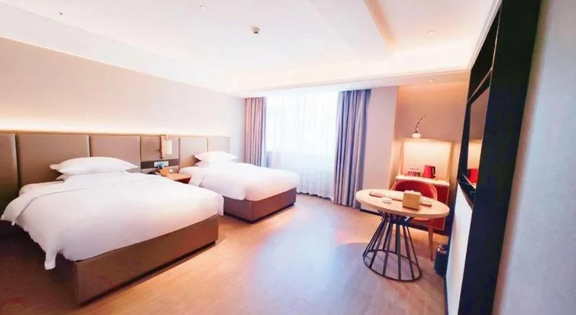 Bed in Echeng Hotel Hezhou Shizheng Square