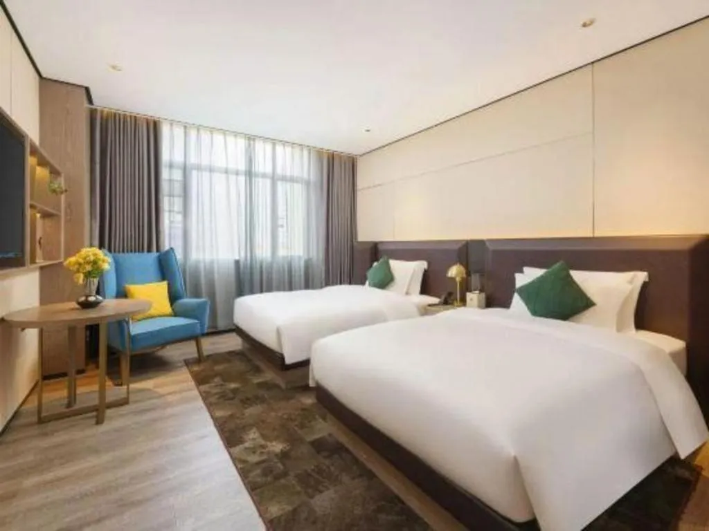 Bed in Echarm Plus Hotel Hangzhou Binjiang Xingguang Avenue