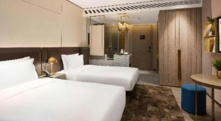Bed in Echarm Plus Hotel Hangzhou Binjiang Xingguang Avenue