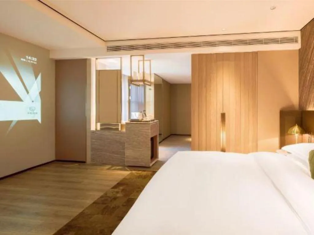 Bed in Echarm Plus Hotel Hangzhou Binjiang Xingguang Avenue