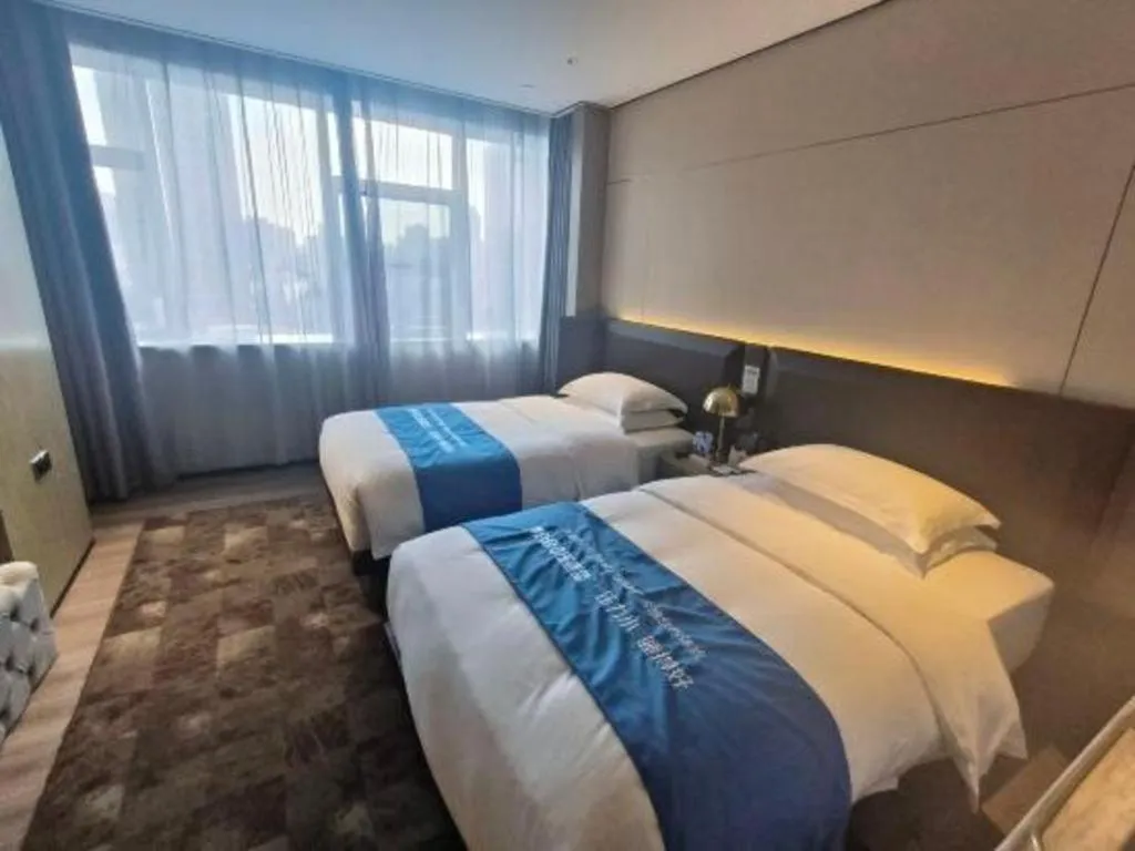 Bed in Echarm Plus Hotel Hangzhou Binjiang Xingguang Avenue