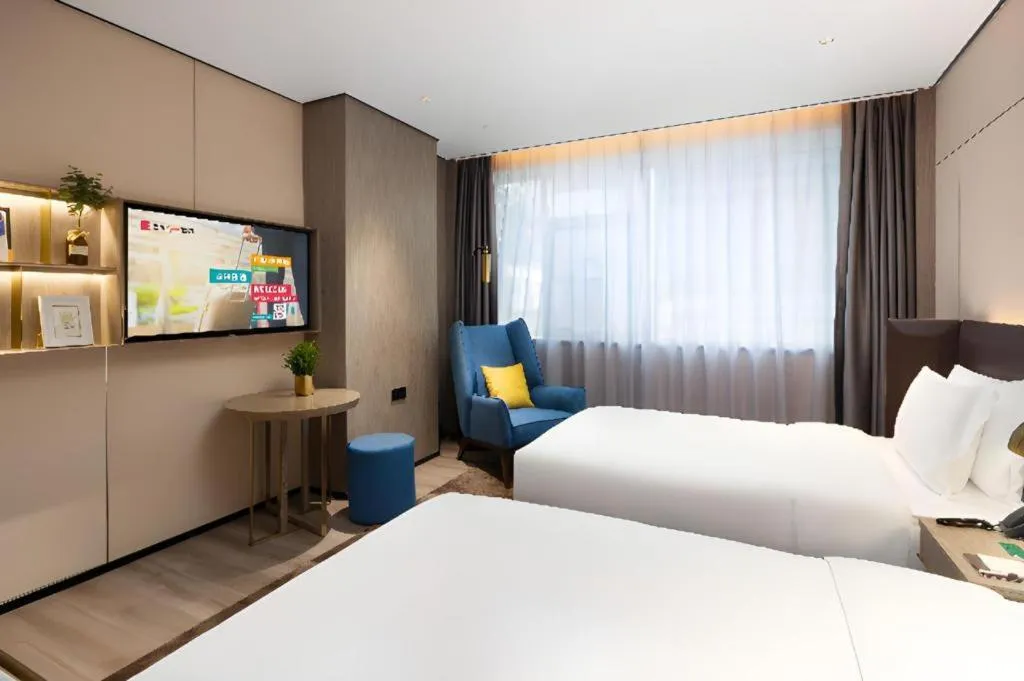 Bed in Echarm Plus Hotel Hangzhou Binjiang Xingguang Avenue