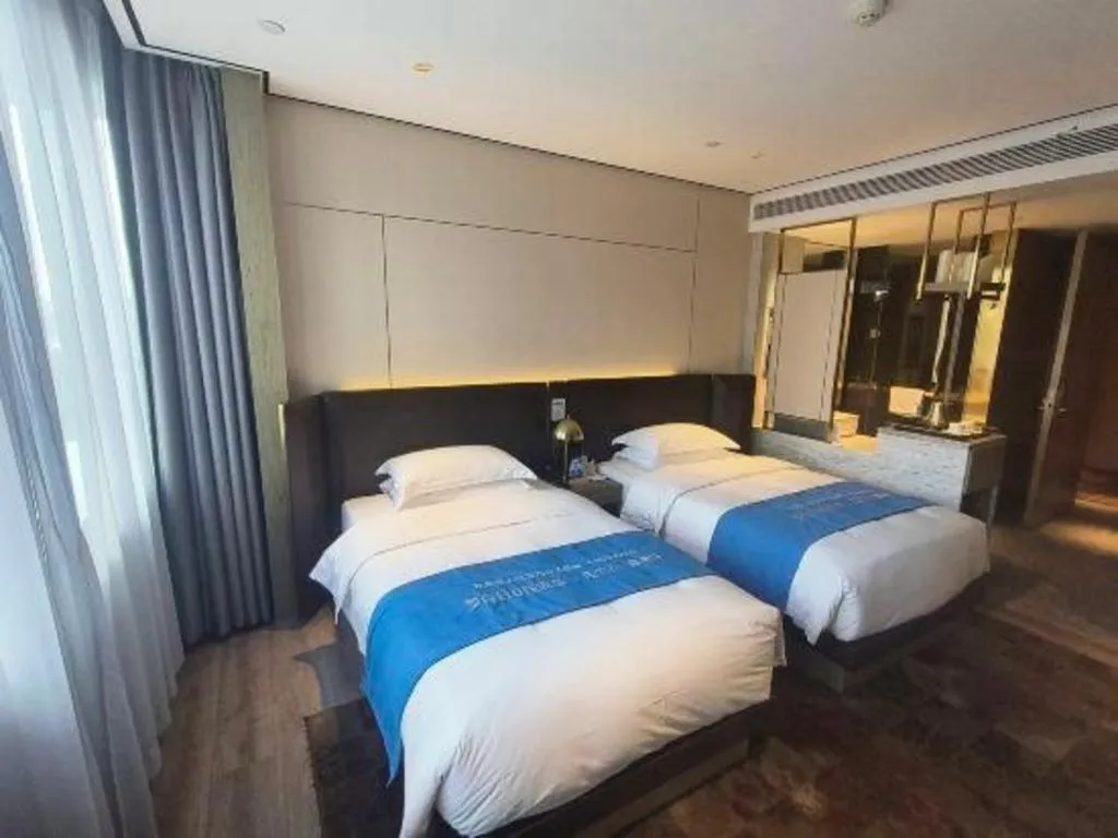 Bed in Echarm Plus Hotel Hangzhou Binjiang Xingguang Avenue
