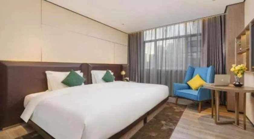 Bed in Echarm Plus Hotel Hangzhou Binjiang Xingguang Avenue