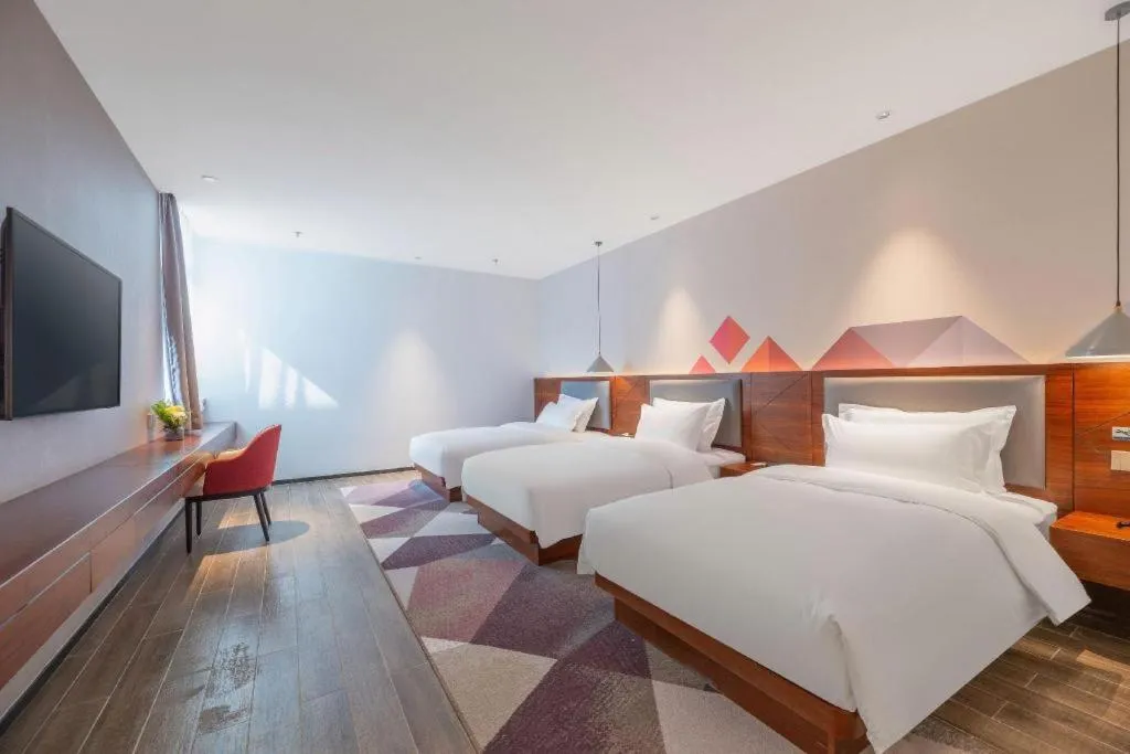 Bed in Borrman Hotel Guilin North Railway Station Zhonghao International