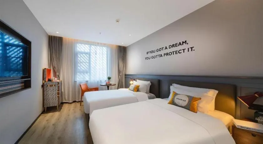 Bed in Premier City Comfort Hotel Suizhou Wuyue Plaza