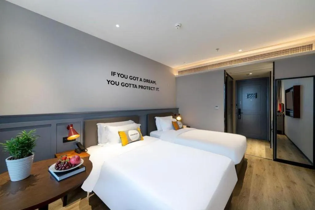 Bed in Premier City Comfort Hotel Suizhou Wuyue Plaza