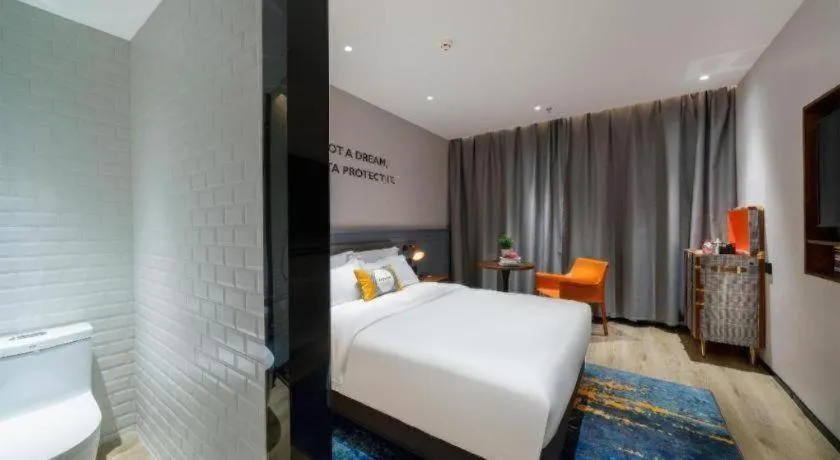 Bed in Premier City Comfort Hotel Suizhou Wuyue Plaza