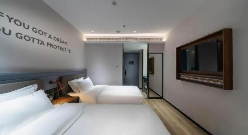 Bed in Premier City Comfort Hotel Suizhou Wuyue Plaza