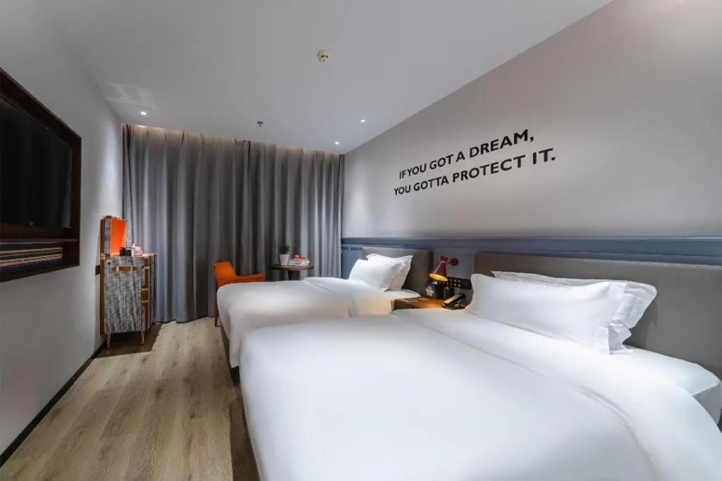 Bed in Premier City Comfort Hotel Suizhou Wuyue Plaza