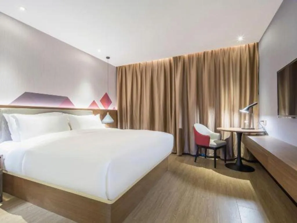 Bed in Borrman Hotel Wuzhou Teng County