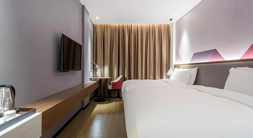 Bed in Borrman Hotel Wuzhou Teng County