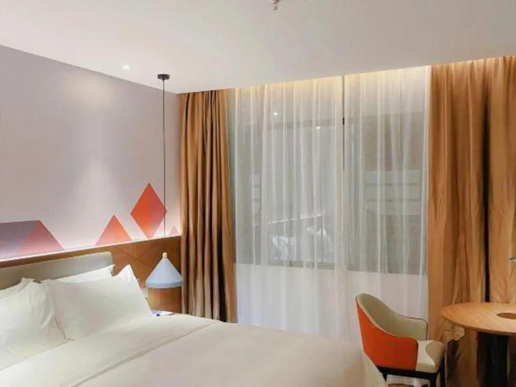 Bed in Borrman Hotel Wuzhou Teng County