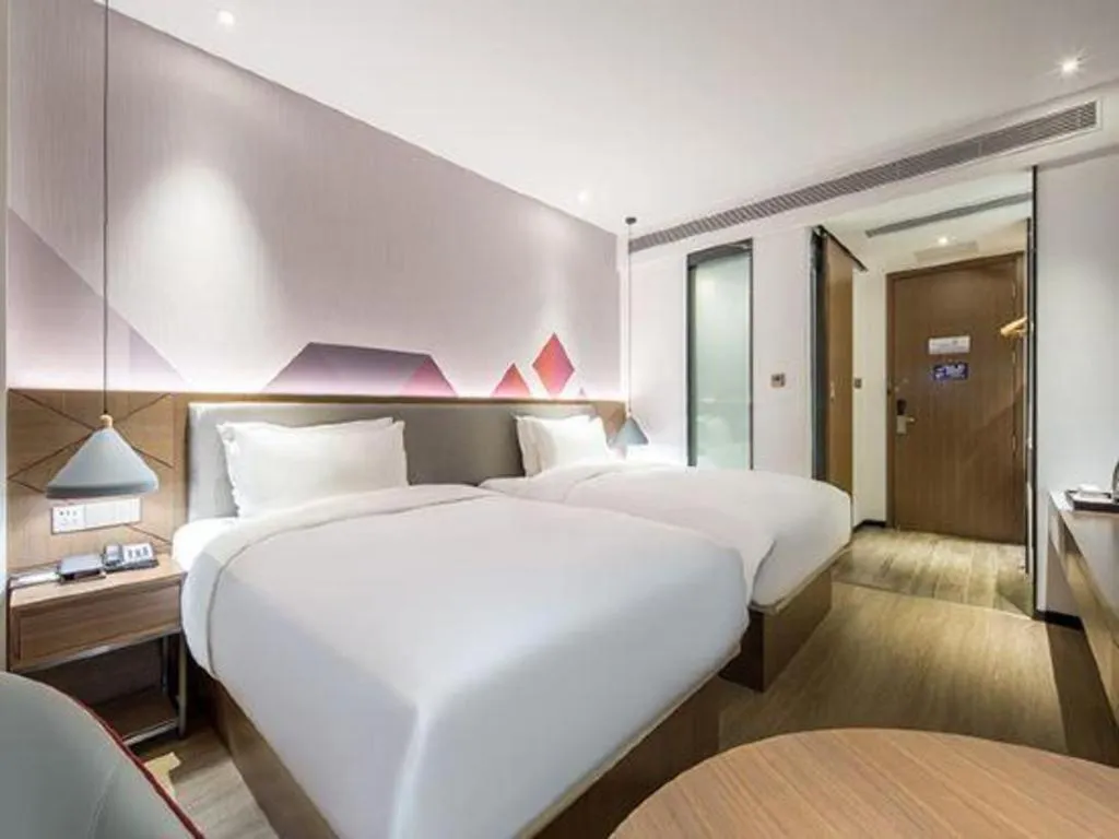Bed in Borrman Hotel Wuzhou Teng County