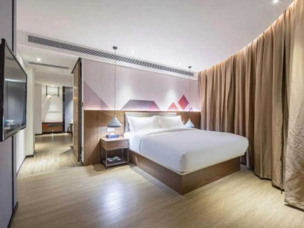 Bed in Borrman Hotel Wuzhou Teng County