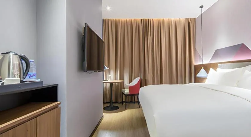 Bed in Borrman Hotel Wuzhou Teng County