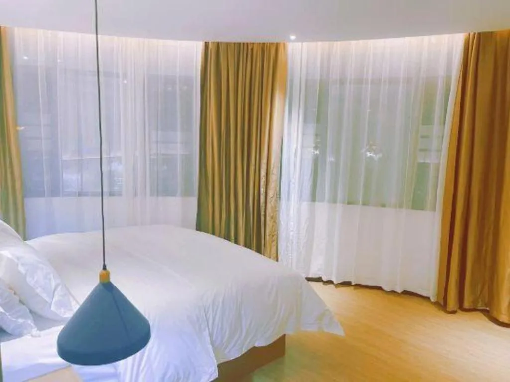 Bed in Borrman Hotel Wuzhou Teng County