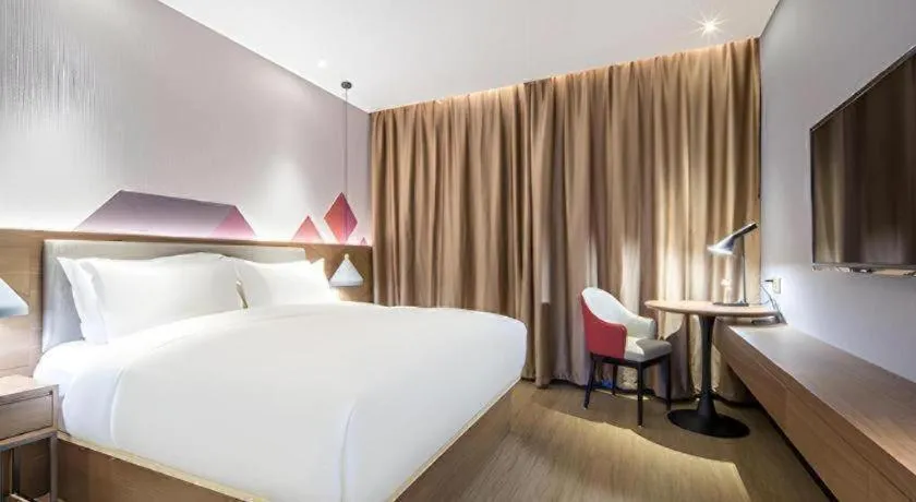 Bed in Borrman Hotel Wuzhou Teng County